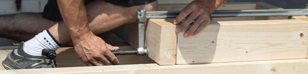 carpenter clamping wood together