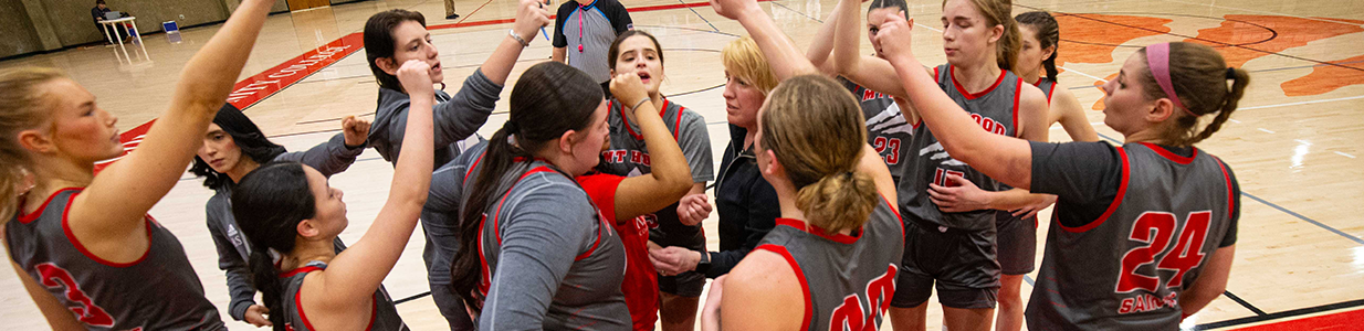 MHCC women's basketball team in a huddle